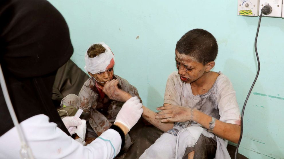 PHOTO: A doctor treats children injured by an airstrike in Saada, Yemen Aug. 9, 2018.