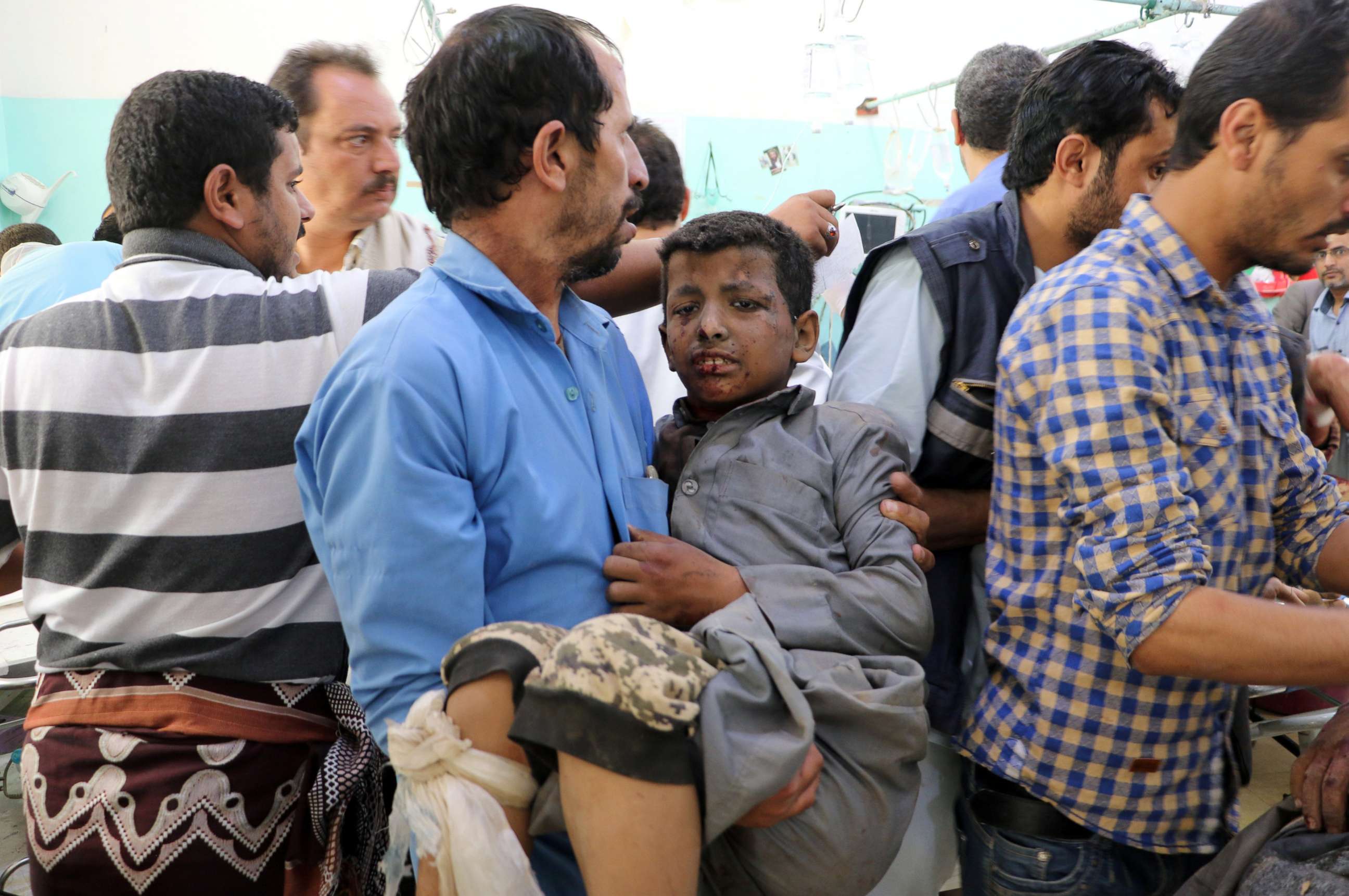 PHOTO: A Yemeni man holds a boy who was injured by an airstrike in Saada, Yemen Aug. 9, 2018.