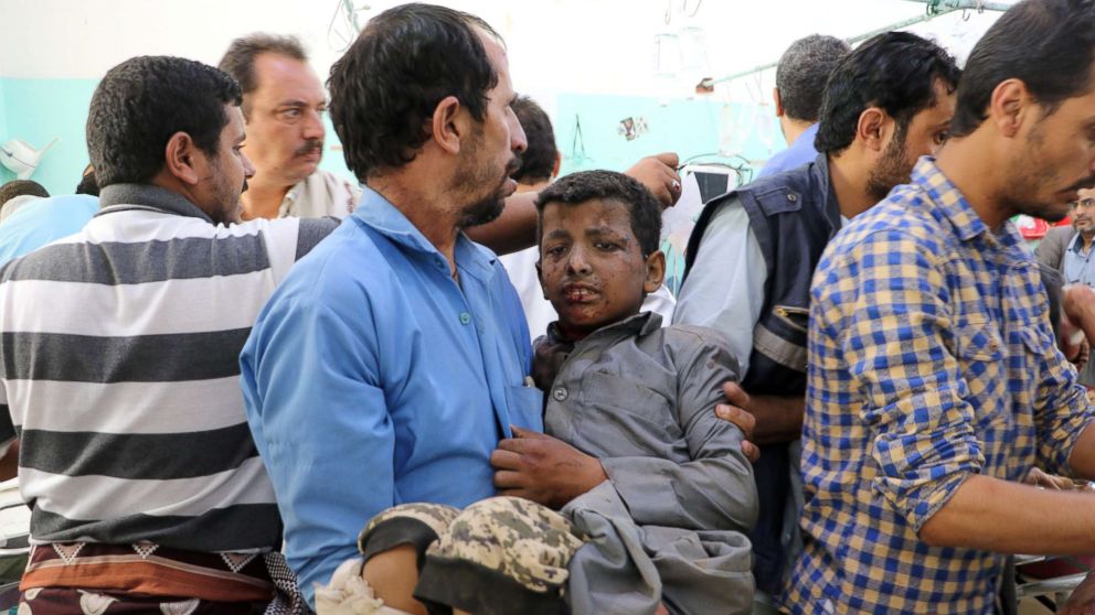 PHOTO: A Yemeni man holds a boy who was injured by an airstrike in Saada, Yemen Aug. 9, 2018.