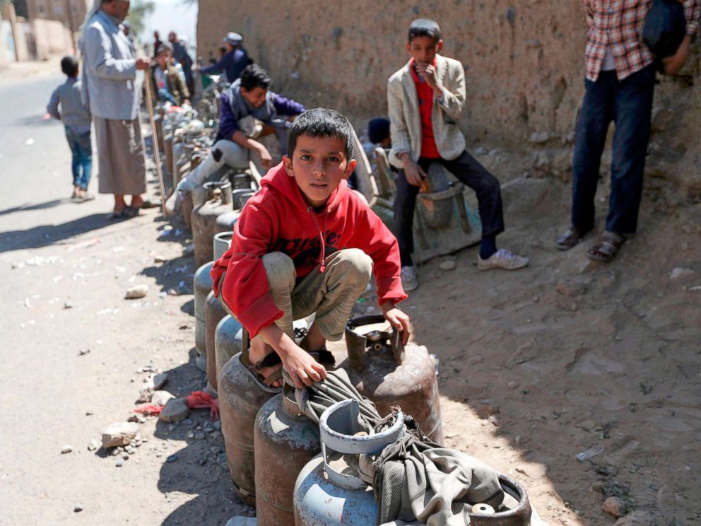 PHOTO: Yemenis wait next to empty gas cylinders for gas supplies amid increasing shortages in the Yemeni capital Sanaa, on Nov. 9, 2017.