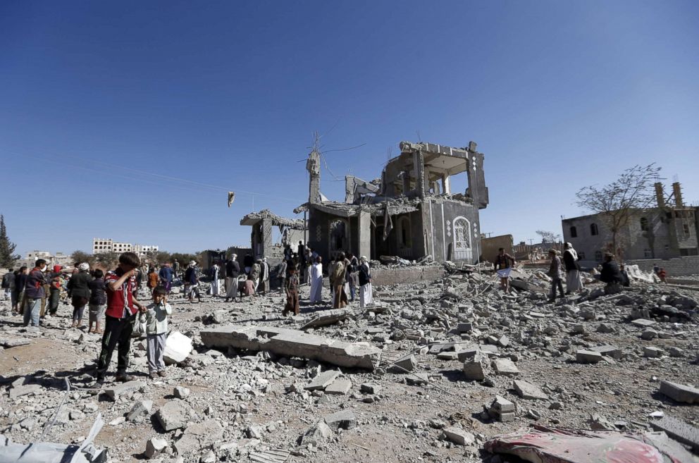 PHOTO: Yemenis check the damage in the aftermath of a reported air strike by the Saudi-led coalition in the Yemeni capital Sanaa, March 8, 2018.