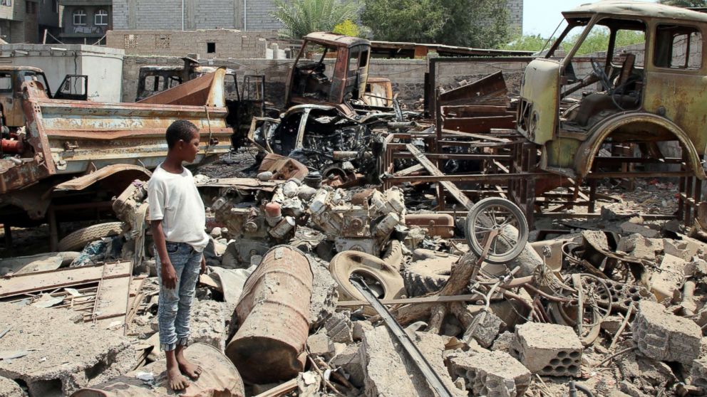 PHOTO: A boy is seen on the site after a car bomb ripped through a military kitchen in Aden, Yemen, March 13, 2018.