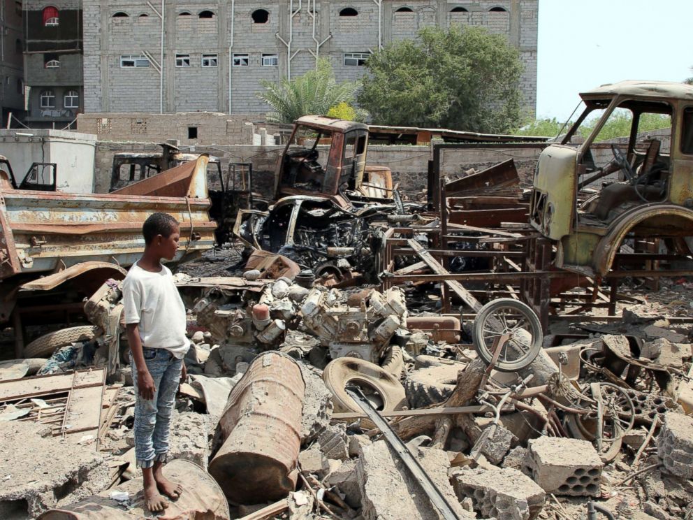 PHOTO: A boy is seen on the site after a car bomb ripped through a military kitchen in Aden, Yemen, March 13, 2018.