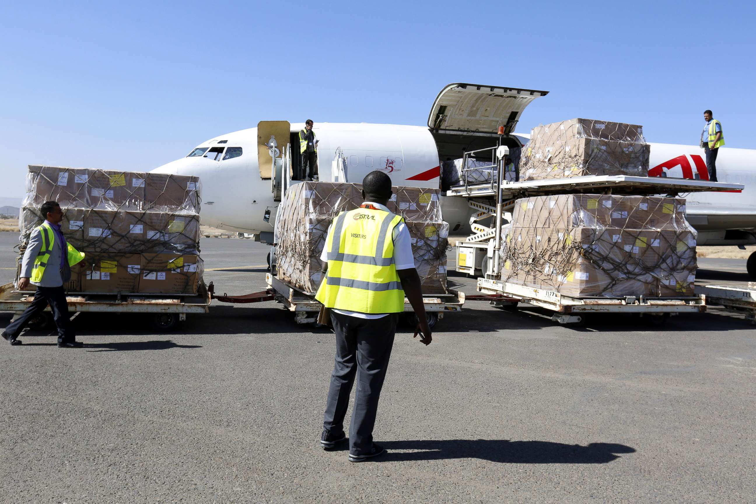 PHOTO: Workers unload emergency medical aid of 1,9 million doses of vaccines supplied by UNICEF at Sana'a International Airport after it was reopened to UN humanitarian air flights, in Sana'a, Yemen, Nov. 25, 2017.