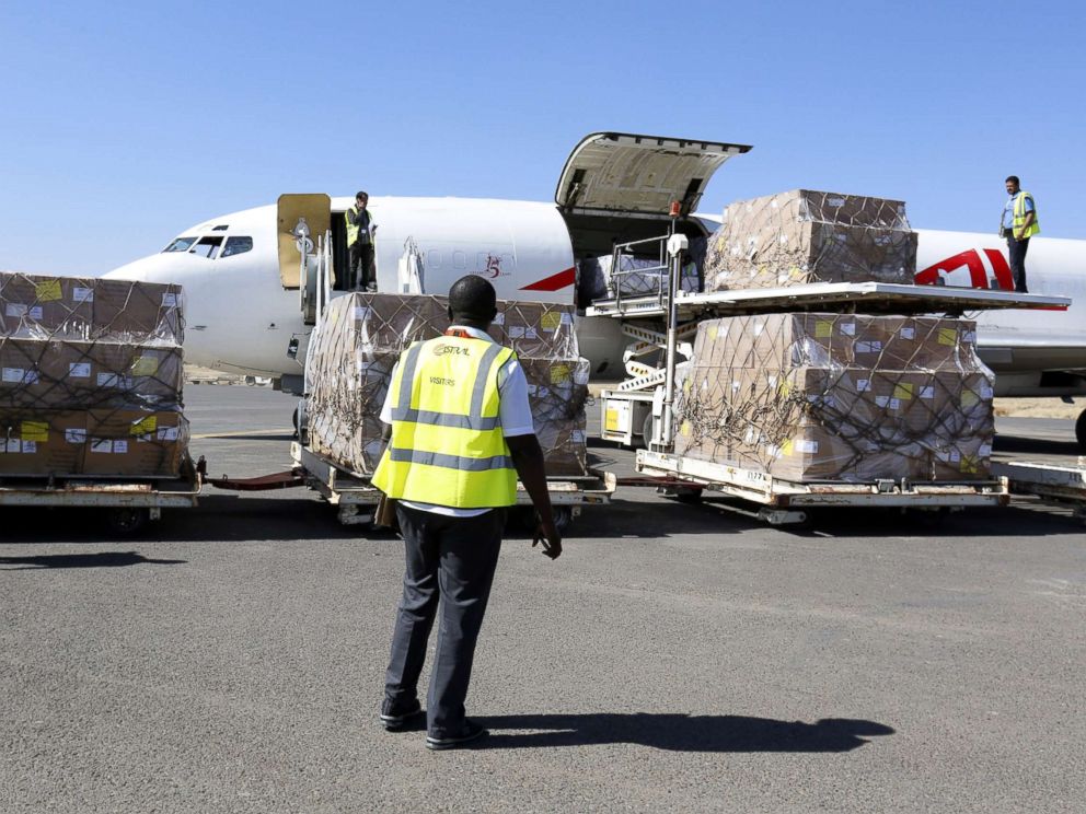 PHOTO: Workers unload emergency medical aid of 1,9 million doses of vaccines supplied by UNICEF at Sanaa International Airport after it was reopened to UN humanitarian air flights, in Sanaa, Yemen, Nov. 25, 2017.