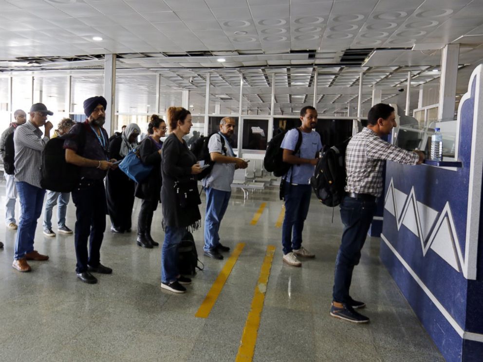 PHOTO: UN aid workers wait to get their passports stamped upon arrival at Sanaa International Airport after it was reopened to UN humanitarian air flights, in Sanaa, Yemen, Nov. 25, 2017.