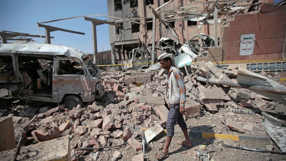 PHOTO: A man inspects rubble after a Saudi-led coalition airstrike in Sanaa, Yemen.