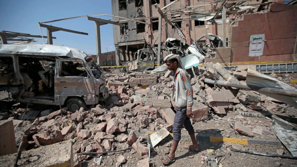 PHOTO: In this Feb. 4, 2018, file photo, a man inspects rubble after a Saudi-led coalition airstrike in Sanaa, Yemen.