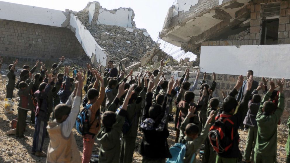 Yemeni students gather in lines for morning assembly on the first week of a new school year at a public school bombed by Saudi-led air strikes in Ibb, Yemen, Oct. 18, 2017.