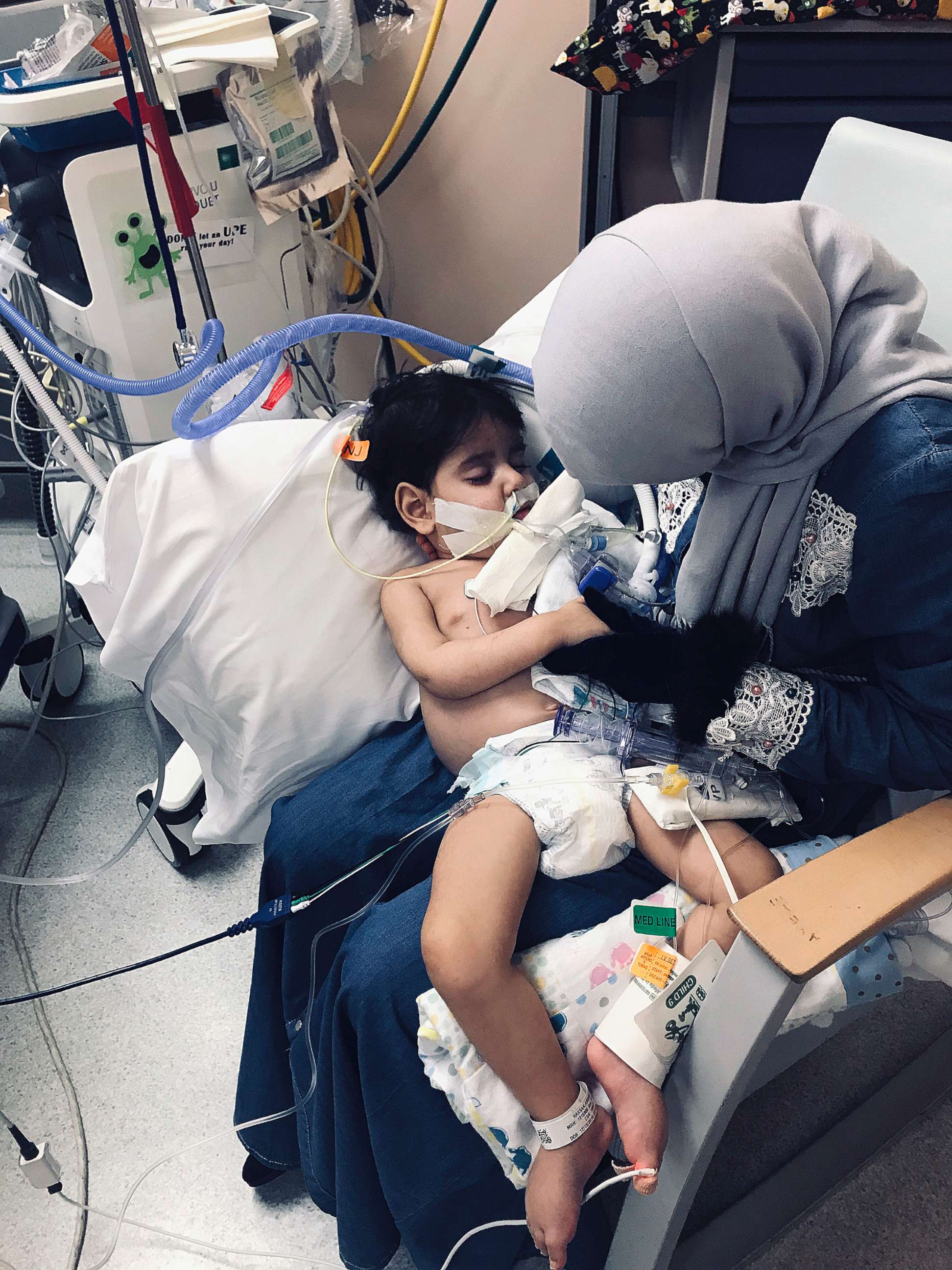 PHOTO: Shaima Swileh holds her dying 2-year-old son Abdullah at a hospital in Oakland, Calif., Dec. 19, 2018, in a photo released by the Council on American-Islamic Relations, Sacramento Valley.