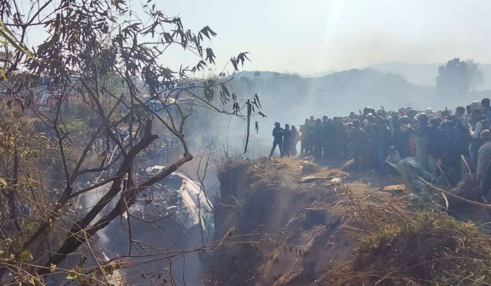 PHOTO: Crowds gather at the crash site of an aircraft in Pokhara in western Nepal Jan. 15, 2023.