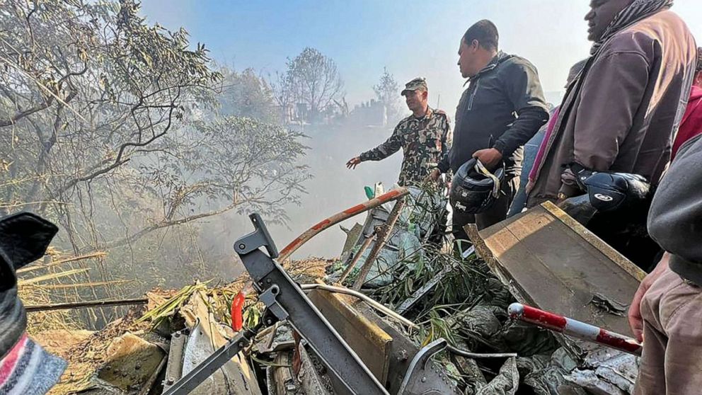 PHOTO: Rescuers gather at the site of a plane crash in Pokhara, Nepal, on Jan. 15, 2023.