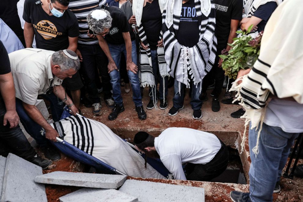 PHOTO: Family and friends mourn during the funeral of Israeli man, Yigal Yehoshua, who died after succumbing to his wounds, sustained during Arab-Jewish violence in the mixed city of Lod, at a cemetery in Moshav Hadid, Israel, May, 18, 2021.