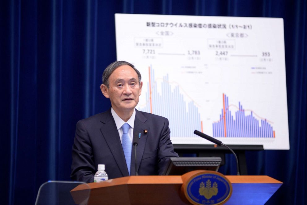 PHOTO: Japanese Prime Minister Yoshihide Suga speaks during a press conference in Tokyo on Feb. 2, 2021, to announce his government has approved a month-long extension of its COVID-19 state of emergency.