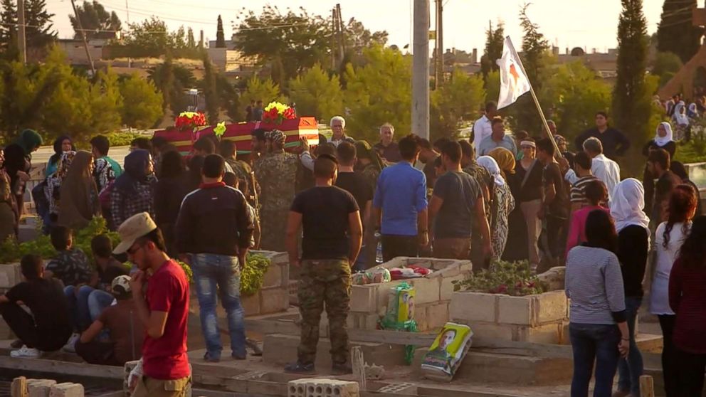 PHOTO: Soldiers and loved ones mourn the loss of the dead.