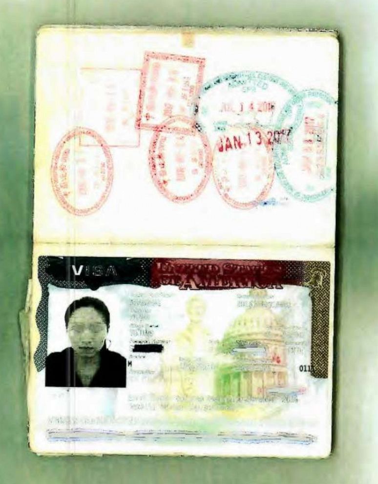 A passport photo of Yujing Zhang, alleged Mar-a-Lago intruder, was entered into evidence during a pre-trial hearing in Florida.