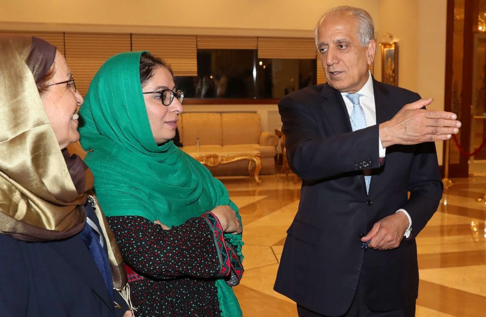 PHOTO: US Special Representative for Afghanistan Reconciliation Zalmay Khalilzad speaks with Asila Wardak during the Intra Afghan Dialogue talks in the Qatari capital Doha on July 8, 2019.