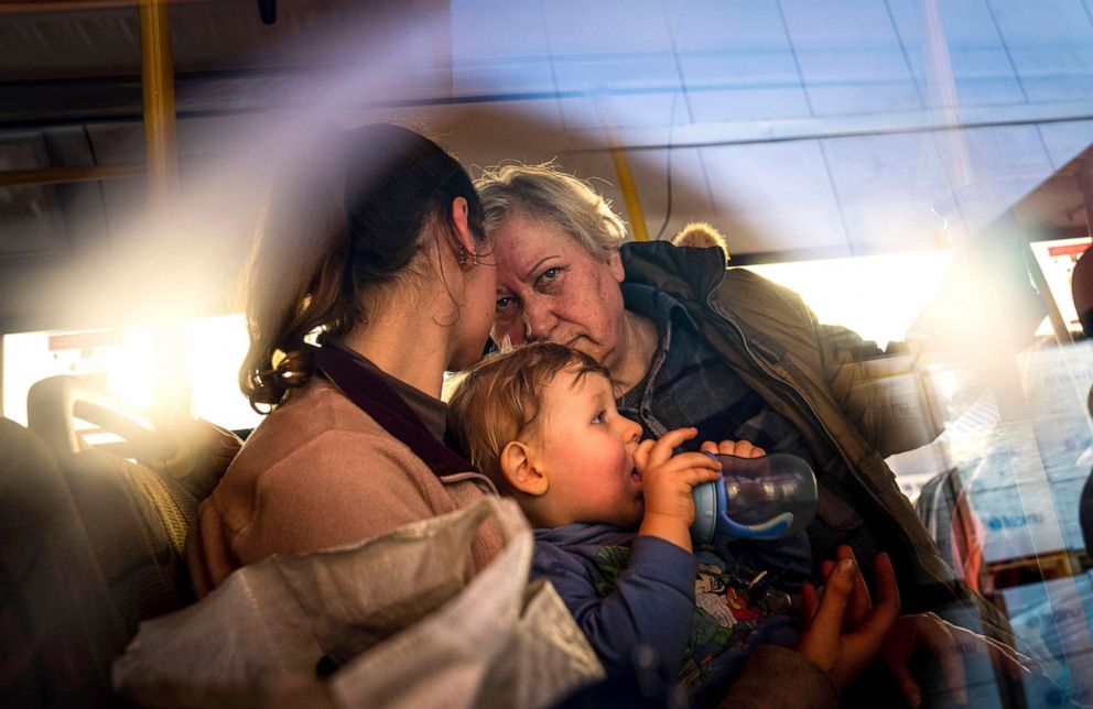 PHOTO: People with children wait after arriving from the Ukrainian city of Mariupol at a center for displaced people in Zaporizhzhia, Ukraine, May 3, 2022.