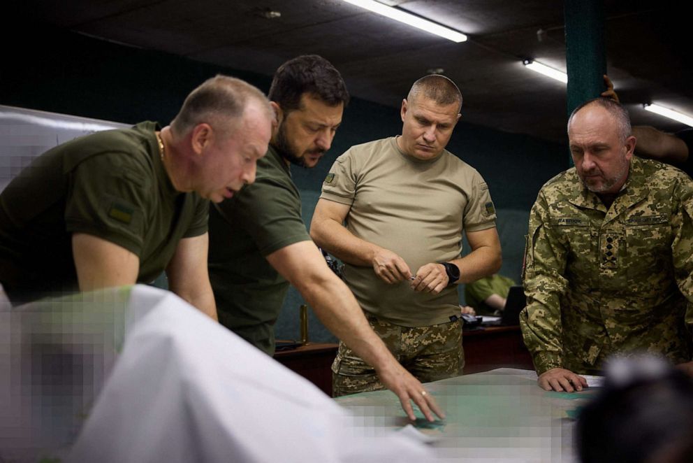 PHOTO: President of Ukraine Volodymyr Zelensky (2ndL) and the colonel general Oleksandr Syrskyi (L) visiting the brigades engaged in offensive operations in the Bakhmut sector, in Donetsk region, amid the Russian invasion of Ukraine, Sept. 5, 2023.