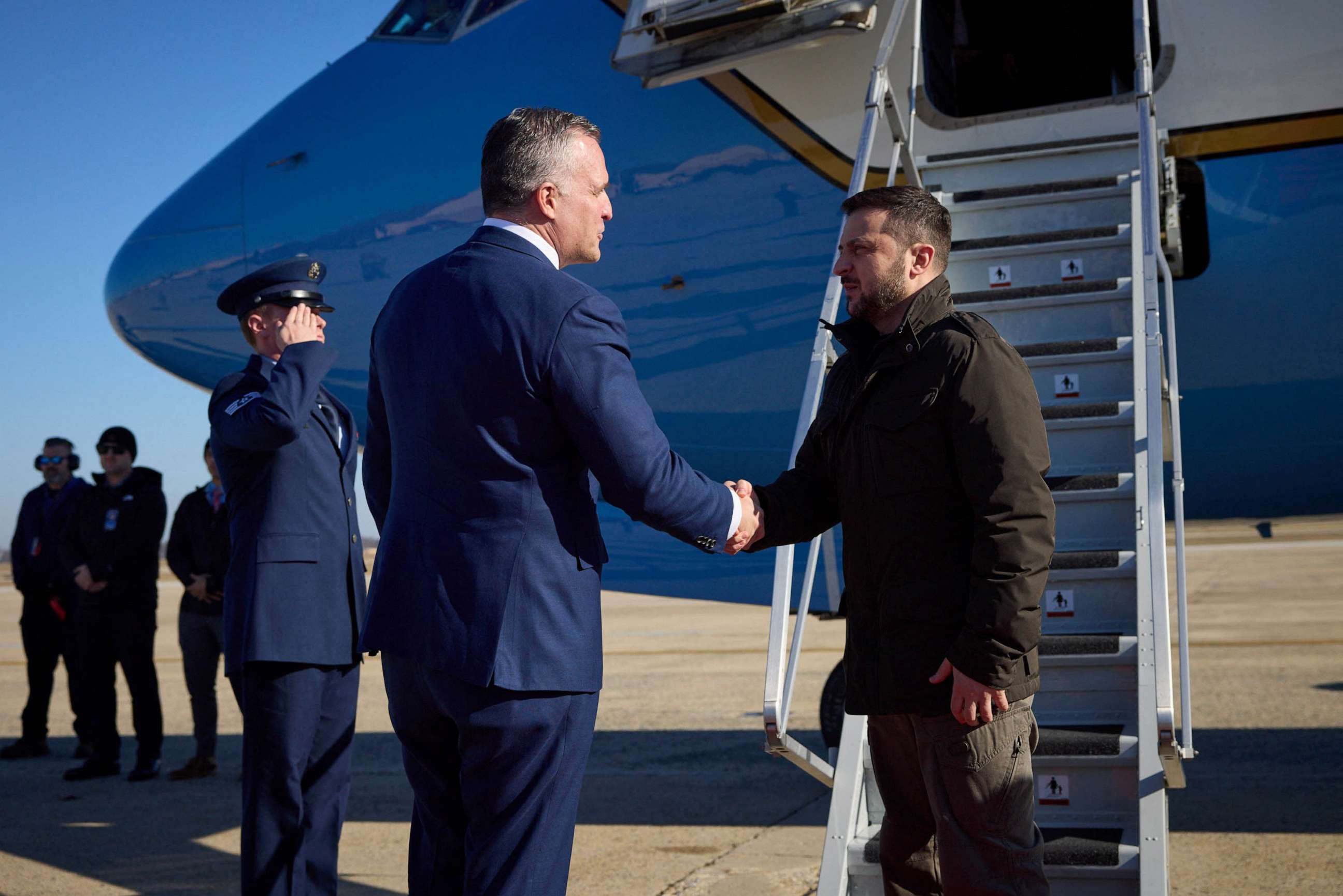 PHOTO: Ukraine's President Volodymyr Zelenskiy shakes hands with Chief of Protocol of the United States Rufus Gifford as he arrives in Washington amid Russia's attack on Ukraine, Dec. 21, 2022.