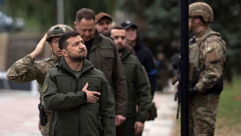 PHOTO: Ukrainian President Volodymyr Zelenskyy takes part in a national flag-raising ceremony in Izium, Ukraine, Sept. 14, 2022. Zelenskyy visited the recently liberated city, greeting soldiers and thanking them for their efforts in retaking the area.