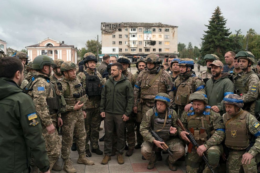 PHOTO: Ukrainian President Volodymyr Zelenskyy stands with soldiers after attending a national flag-raising ceremony in Izium, Ukraine, Sept. 14, 2022. Zelenskyy visited the recently liberated city, thanking soldiers for their efforts in retaking the area