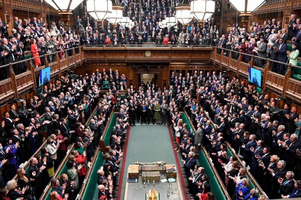 PHOTO: Ukrainian President Volodymyr Zelenskyy receives a standing ovation as he addresses British lawmakers via video link, in the House of Commons in London, March 8, 2022.