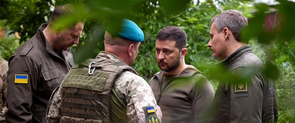 PHOTO: In this photo provided by the Ukrainian Presidential Press Office, Ukrainian president Volodymyr Zelenskyy, second right, listens to military commander as he visits the Donetsk region, Ukraine, May 23, 2023.