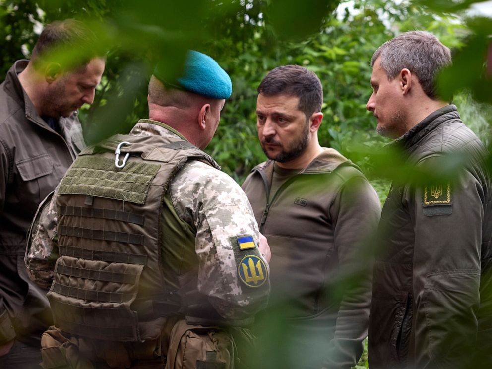 PHOTO: In this photo provided by the Ukrainian Presidential Press Office, Ukrainian president Volodymyr Zelenskyy, second right, listens to military commander as he visits the Donetsk region, Ukraine, May 23, 2023.