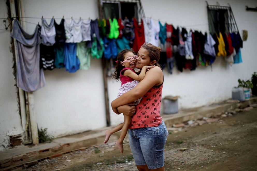 PHOTO: Gabriela Alves de Azevedo, 22, holds her two-year-old daughter Ana Sophia, who was born with microcephaly, at their house in Olinda, Brazil, Aug. 7, 2018.