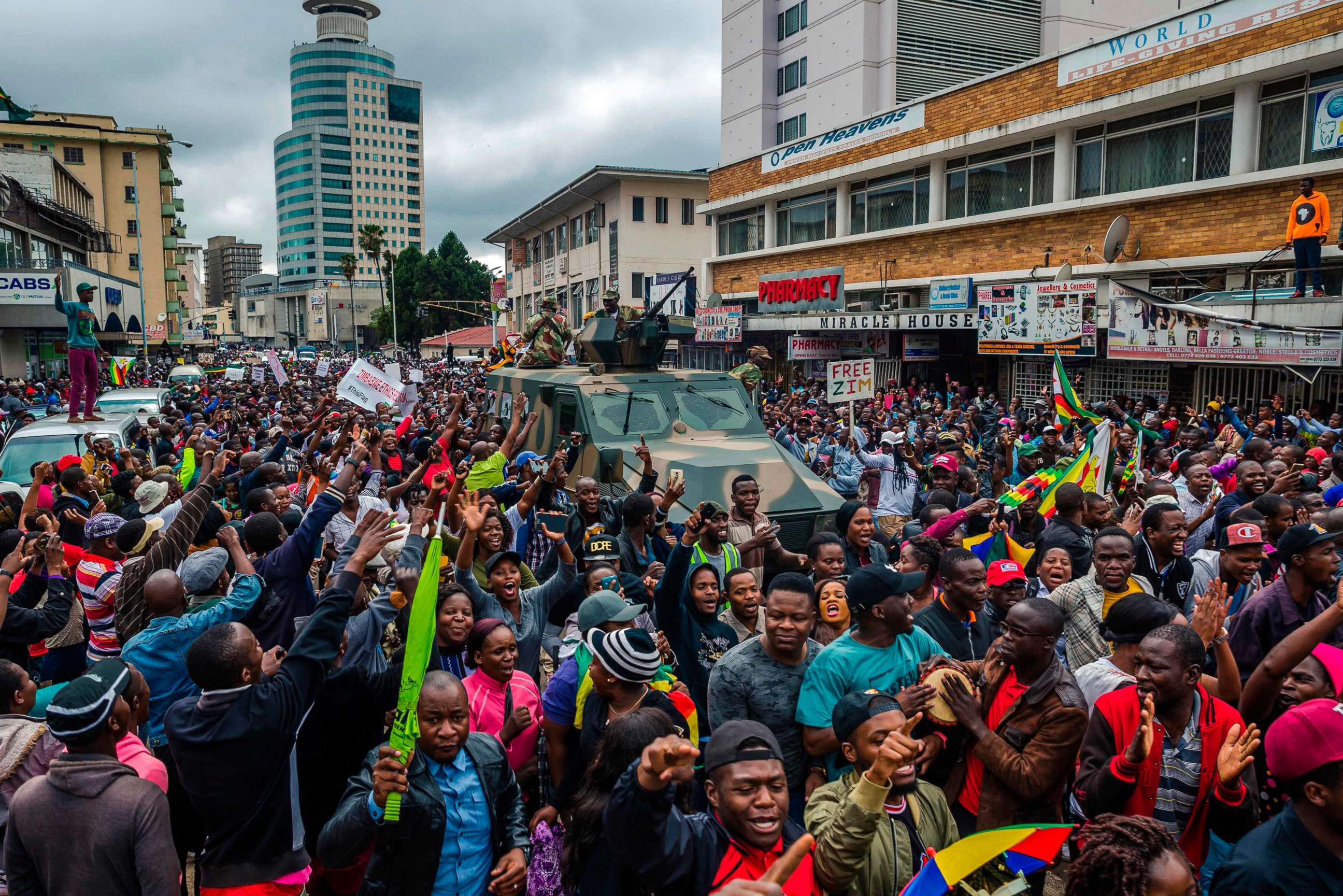 PHOTO: People cheer a passing Zimbabwe Defense Force military vehicle during a demonstration demanding the resignation of President Robert Mugabe, Nov. 18, 2017 in Harare, Zimbabwe.

