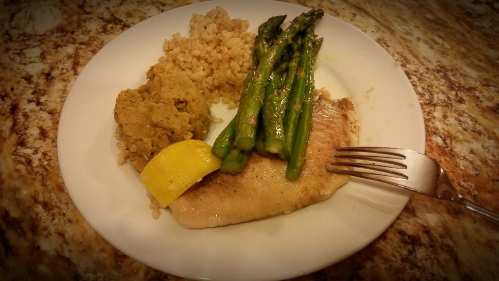 PHOTO: Her dinner: baked tilapia, asparagus, brown rice, and mashed chickpeas.