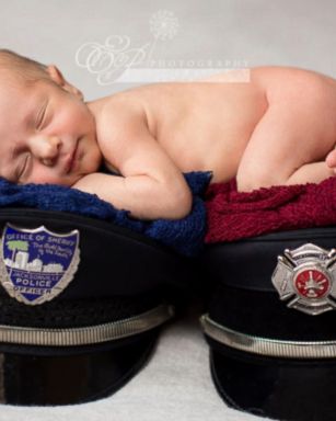 Enzo Anthony Crnolic, 1 month, posed for a newborn photo shoot with his mom's firefighter hat and his dad's police cap.