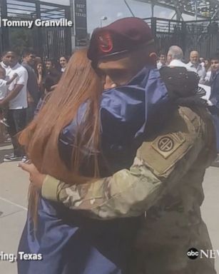 Teen jumps for joy as her brother, who is currently serving in the U.S. Army, surprises her at her high school graduation.