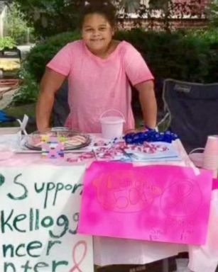 Olivia Ohlson, 10, began selling pink lemonade and pink ribbon cookies to donate to a local cancer center. 