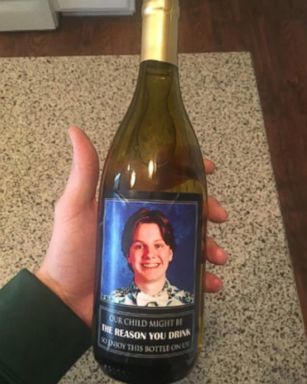 VIDEO: Labels on the wine bottle gifts say, "Our child might be the reason you drink, so enjoy this bottle on us."