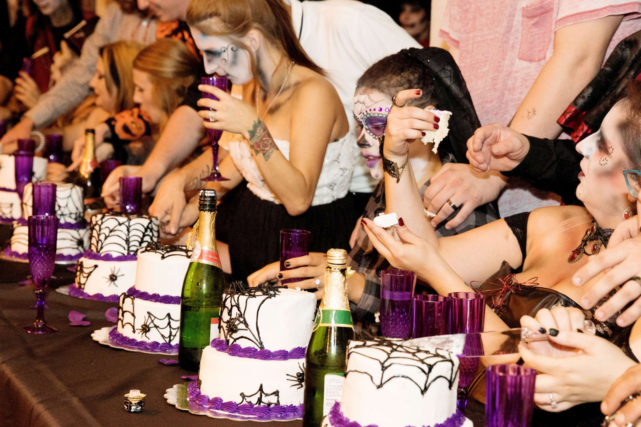 PHOTO: The creepy couples toasted to eternity, and each had personalized spiderweb cakes. 