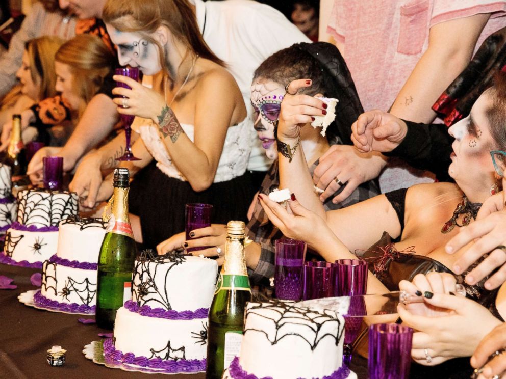 PHOTO: The creepy couples toasted to eternity, and each had personalized spiderweb cakes.