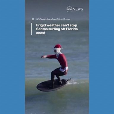 VIDEO: Frigid weather can't stop Santas surfing off Florida coast