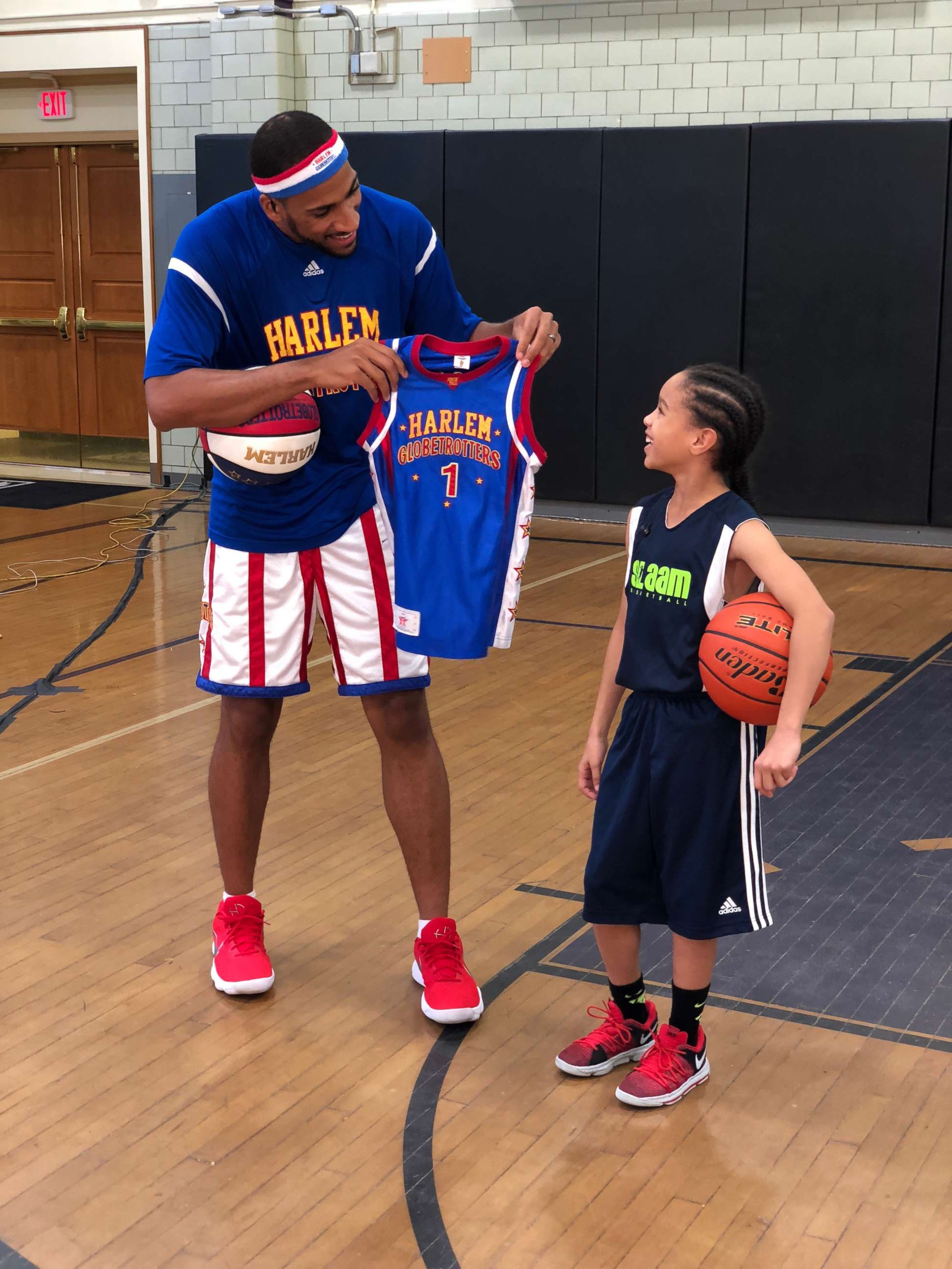 PHOTO: Karis also gained the attention of the Harlem Globetrotters, one of whom surprised her on the court today with her own personal jersey. 