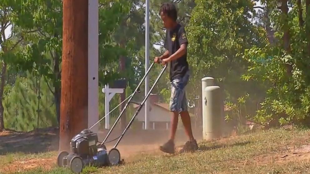 PHOTO: Q'yaron Gadson, 11, was surprised with a brand new lawnmower, weedeater and the gas needed to fuel them.