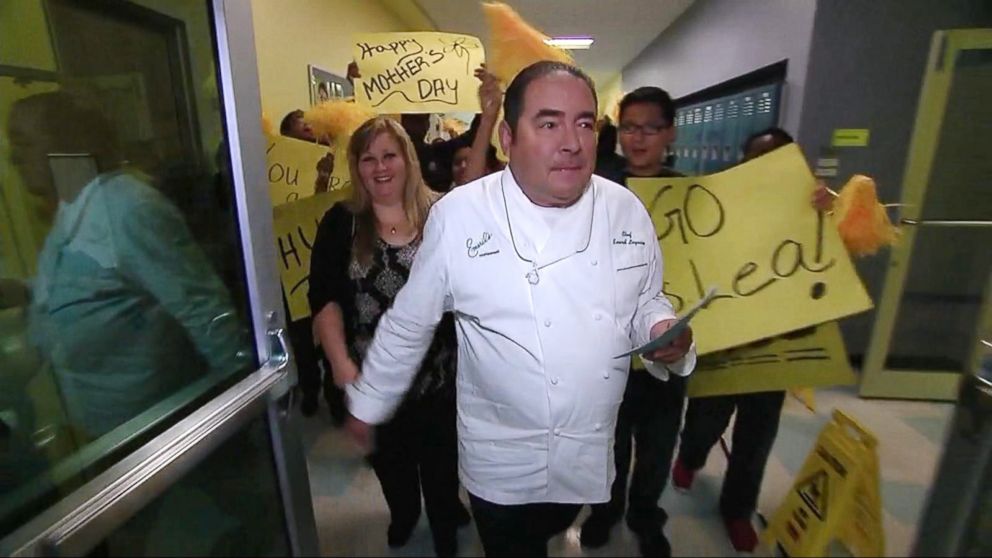 PHOTO: Emeril Lagasse named Lea Siegel, an educator from Fort Worth, Texas, the winner of his annual "Breakfast in Bed" search before leading her into the school's auditorium filled with students. 