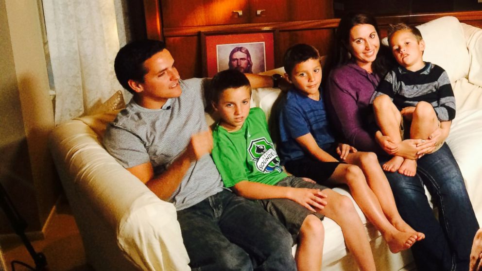 PHOTO:  ABC News' Abbie Boudreau interviews John and Lisa Henderson and their sons.