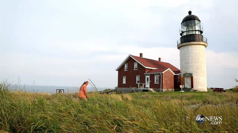 Caretaker Mitchell Thorpe mows the lawn of Seguin Island Light Station in Maine. 