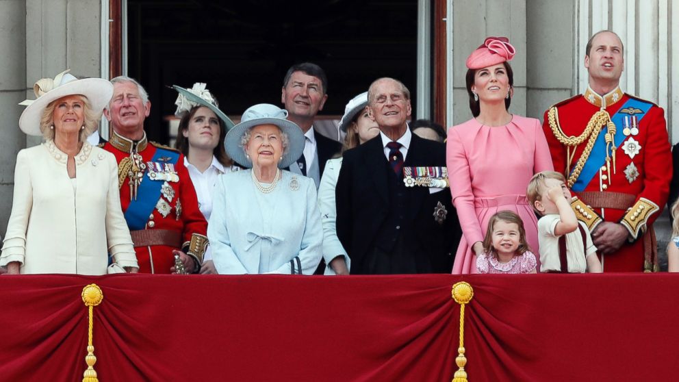 Members of Britain's Royal family from left, Camilla, the Duchess of Cornwall, Prince Charles, Princess Eugenie, Queen Elizabeth II, background Timothy Laurence, Princess Beatrice,  Prince Philip, Kate, the Duchess of Cambridge, Princess Charlotte, Prince George and Prince William watch a fly past as they appear on the balcony of Buckingham Palace, after attending the annual Trooping the Color Ceremony in London, June 17, 2017. 