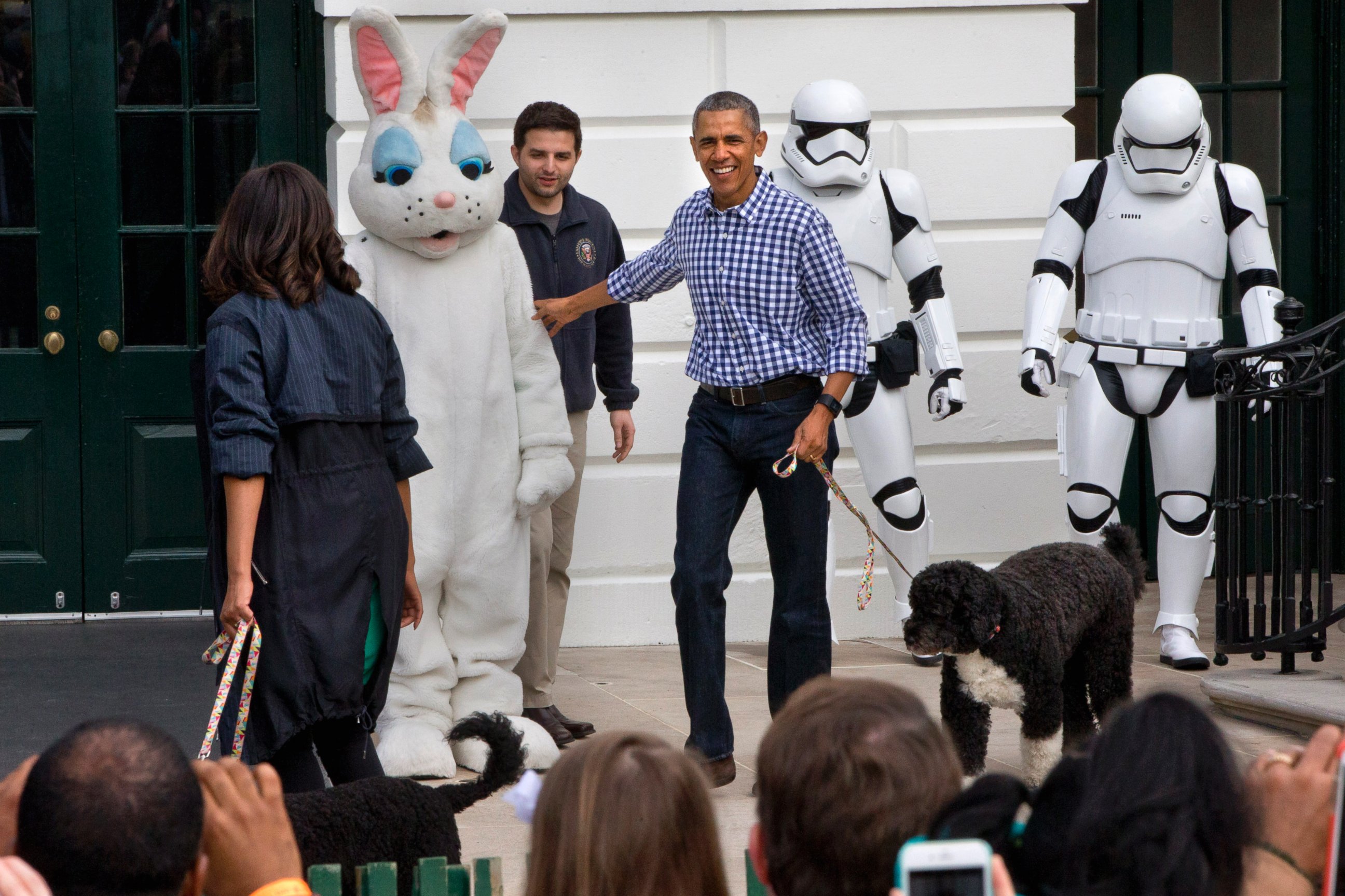 PHOTO: President Barack Obama and first lady Michelle Obama, with the Easter Bunny and their two dogs, Sunny, and Bo, walk past costumed Star Wars Storm Troopers during the White House Easter Egg Roll at the White House on March 28, 2016, in Washington.