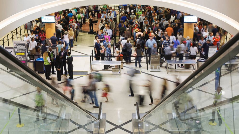 Travelers move through a security checkpoint line at Hartsfield-Jackson Atlanta International Airport, in Atlanta, May 19, 2016.