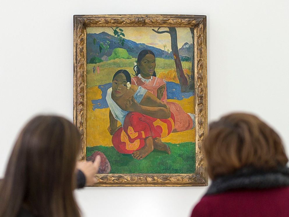 PHOTO: In this Feb. 6, 2015 picture women look at the painting  "Nafea faa ipoipo?" (1892) by French painter Paul Gauguin in the Fondation Beyeler in Riehen, Switzerland. 