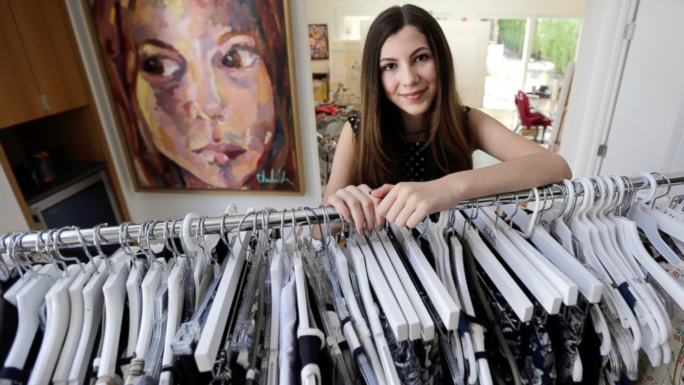 PHOTO: Isabella Rose Taylor, 13, poses with her art work and clothing designs at her home, in Austin, Texas.