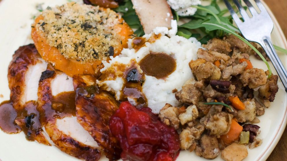 A Thanksgiving dinner plate of cider brined turkey with sage gravy, peach cranberry sauce, sour cream and chive mashed potatoes, sausage pecan stuffing, arugula pear salad with pomegranate vinaigrette and goat cheese and herb crusted sweet potatoes in this Oct. 8, 2012 file photo in Concord, N.H.  